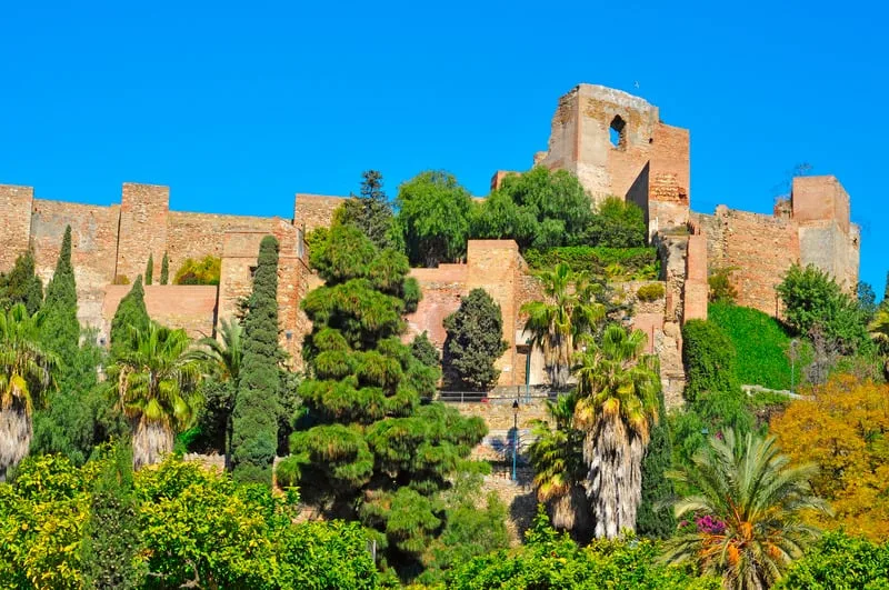 Alcazaba castle in Malaga seen from the outside surrounded by gardens