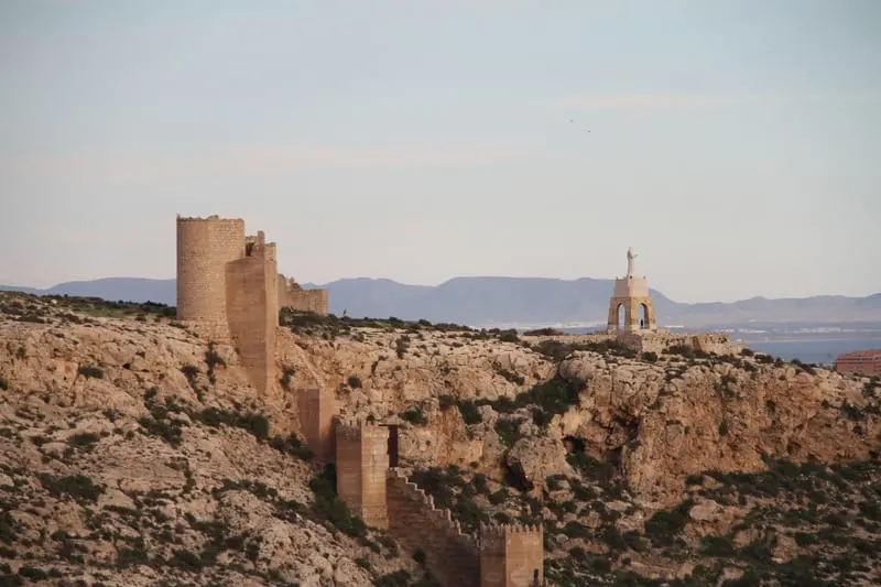 Fortificación de Almeria by a mountain cliff during dusk time