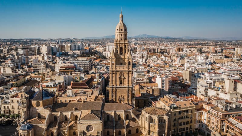 an aerial view of Murcia Cathedral surrounded by buildings or houses