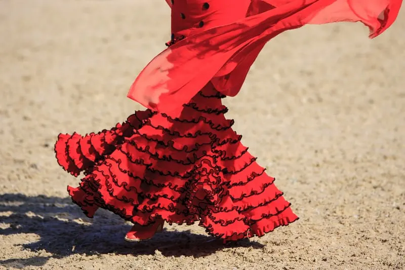 Things to do in Cadiz, Flamenco show, a view of the bottom part of a red flamenco dress