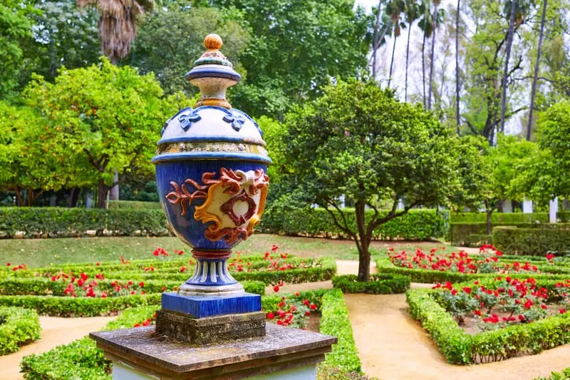 a vase on the center of a beautiful garden at Maria Luisa Park where you can stroll in Seville in June