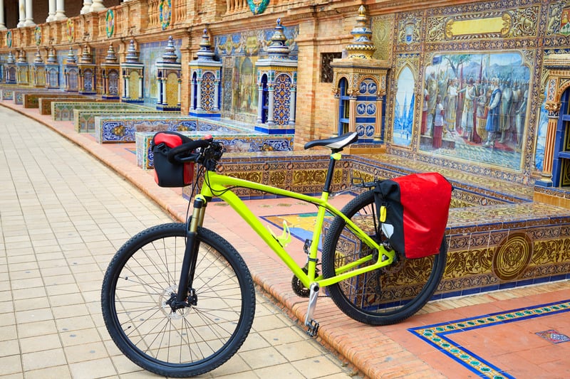 a bike in front of a building in seville. Bike Tours in seville are one of the best things to do in Seville in October