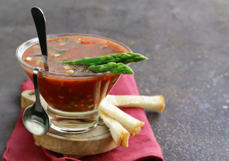 chunky bloody mary gazpacho served in a small glass