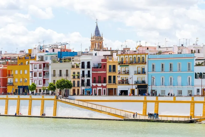 Things to do in Seville, breakfast in Triana, a view of buildings by a body of water