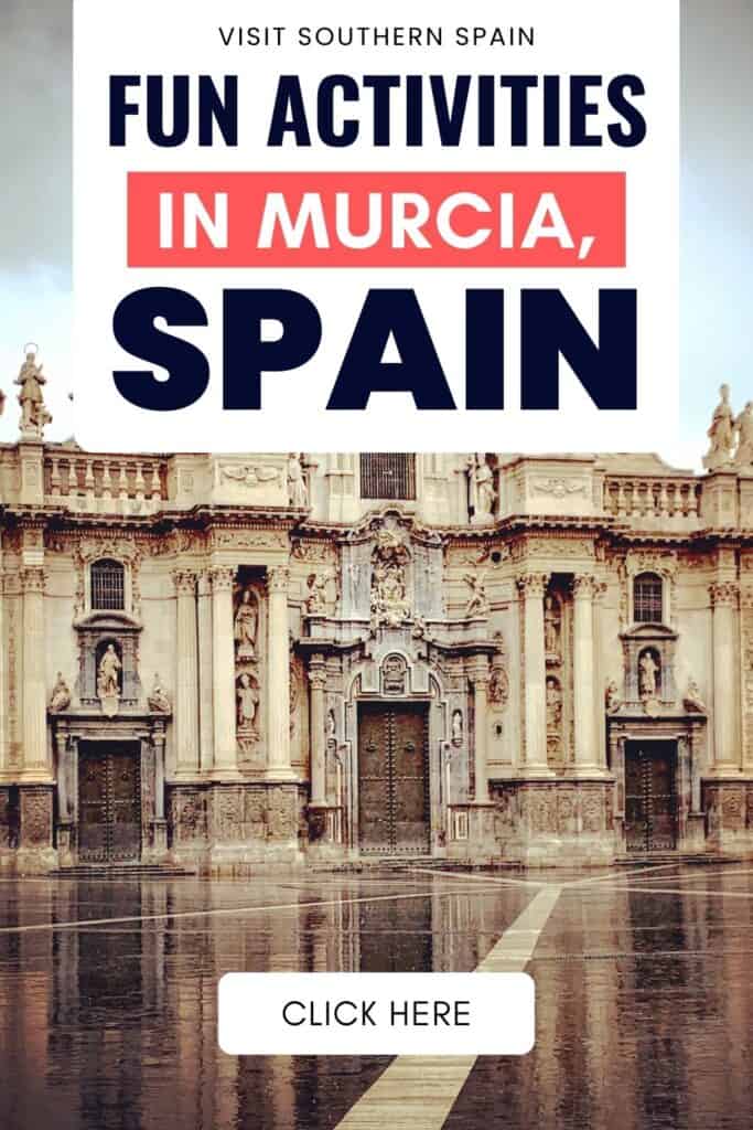 A photo of Murcia's cathedral. The ground is wet and has a reflection of the cathedral.