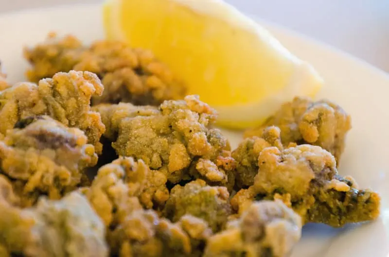 Typical spanish tapa of ortiguillas. little sea nettles, breaded and fried anemone. Cadiz, Andalusia, Spain