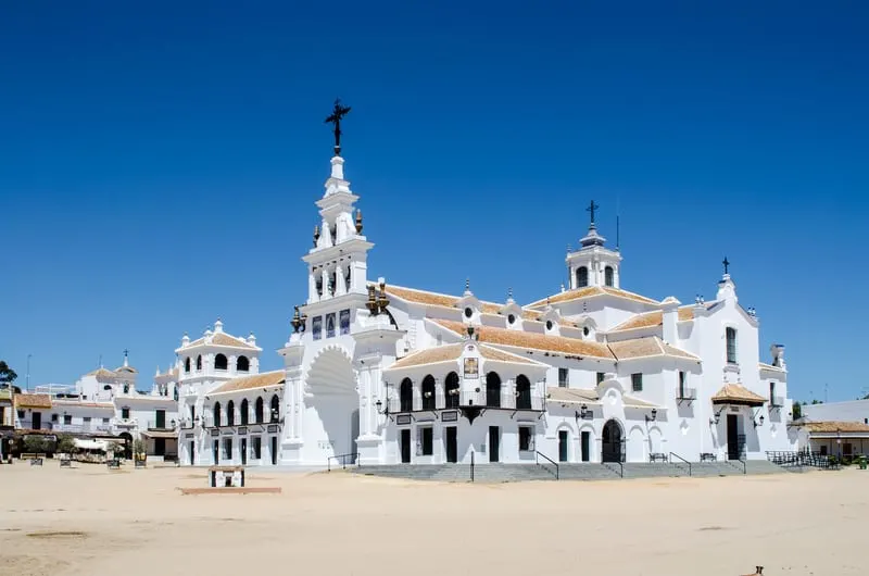 Hermitage del Rocio, Huelva, walls painted in white with orangey roofs and plenty of windows and doors