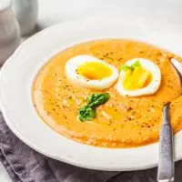 Homemade Cordoba Tomato Soup with egg in white plate.