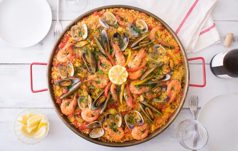 Seafood paella on a kitchen table