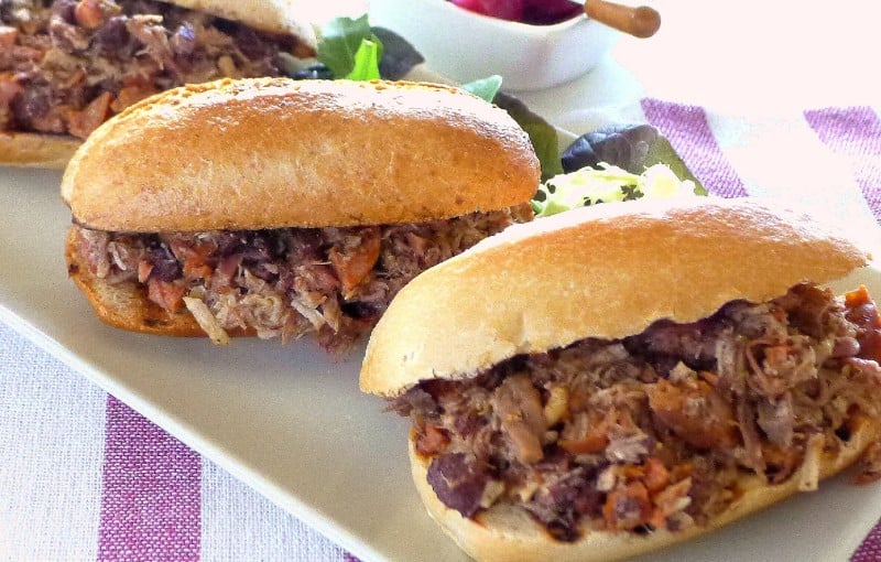 closeup of different kinds of meats in a sandwich 