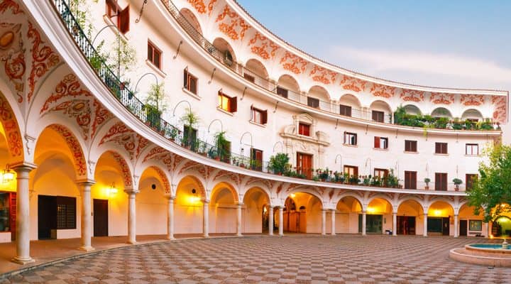 Panorama of picturesque square plaza del Cabildo in the morning, Seville, Andalusia, Spain