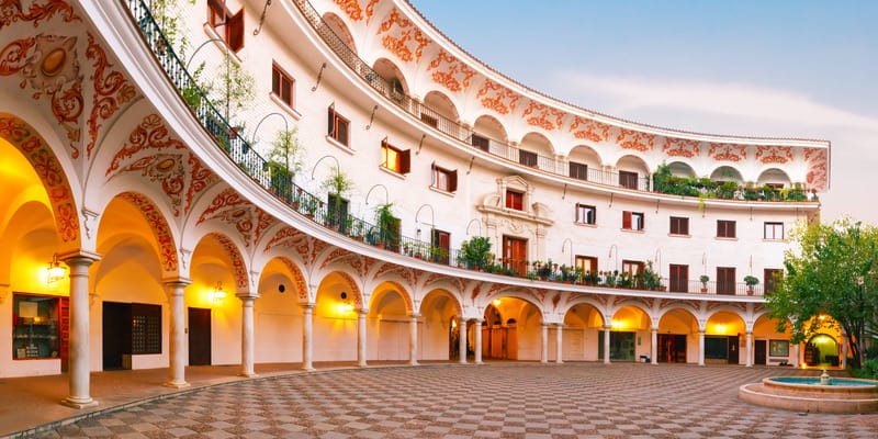 Panorama of picturesque square plaza del Cabildo in the morning, Seville, Andalusia, Spain