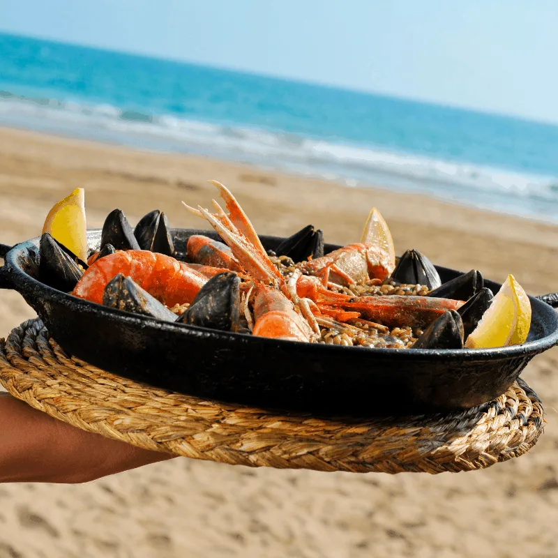 Traditional Paella on the beach in Seville, Spain