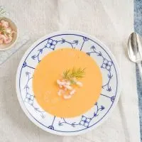spanish shrimp soup served in a white bowl