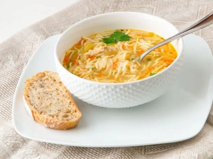 Spanish rice and Chicken soup made with noodles in a bowl.