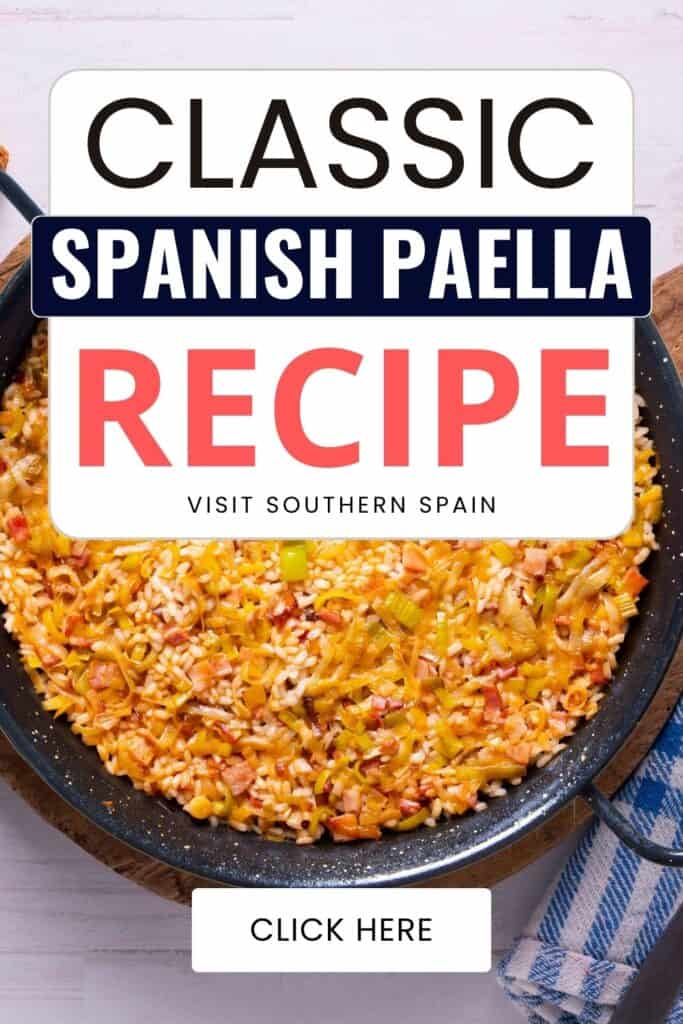 A top view of a paella that is super basic without a lot of ingredients.Just some pieces of ham, rice and onion leaves.