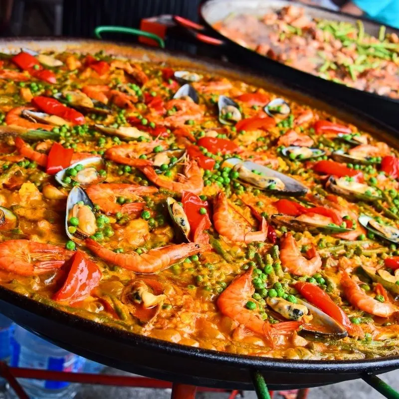 spanish valencian paella reicpe in a traditional pan. Ultimate Valenciana Paella Recipe
