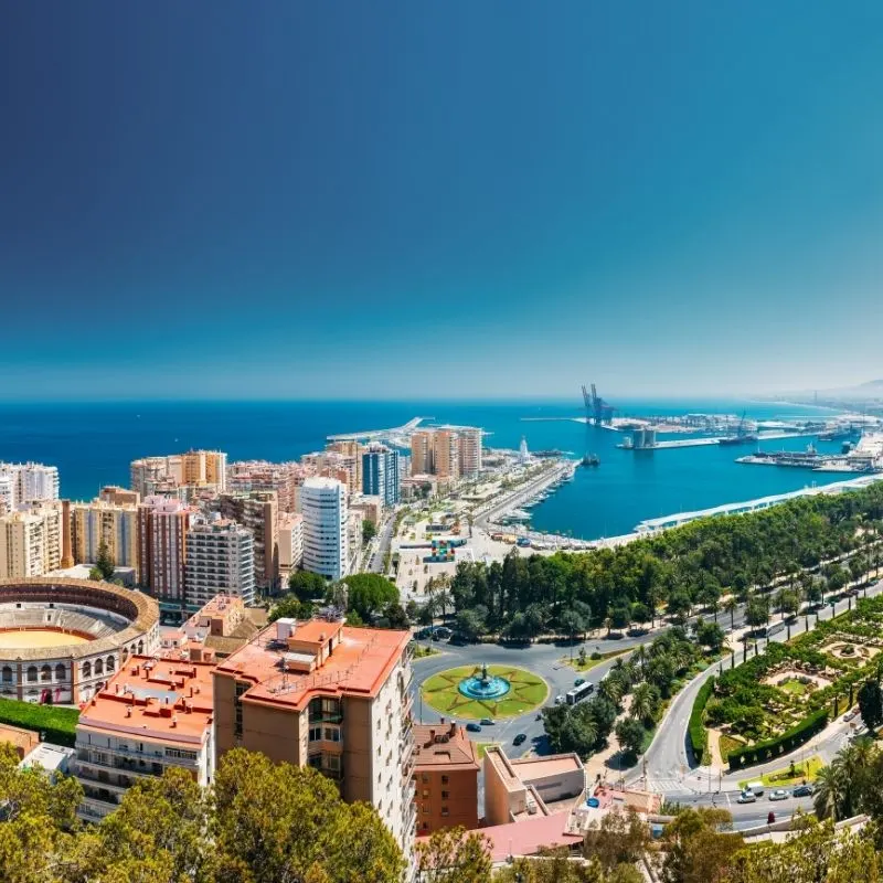 aerial view of the main things to do in malaga in october with the port and sea