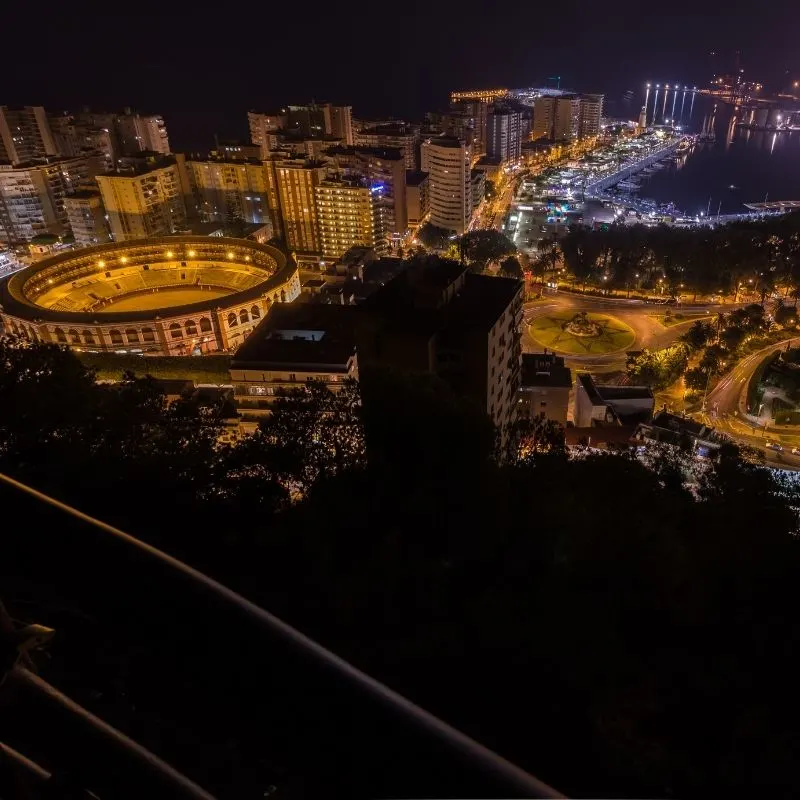 a picture of Malaga skyline at night, Malaga in July