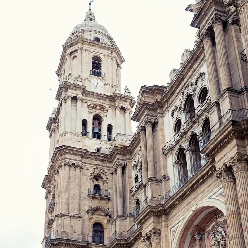 a side view of the Catedral de Encarnación de Malaga focusing on the tower