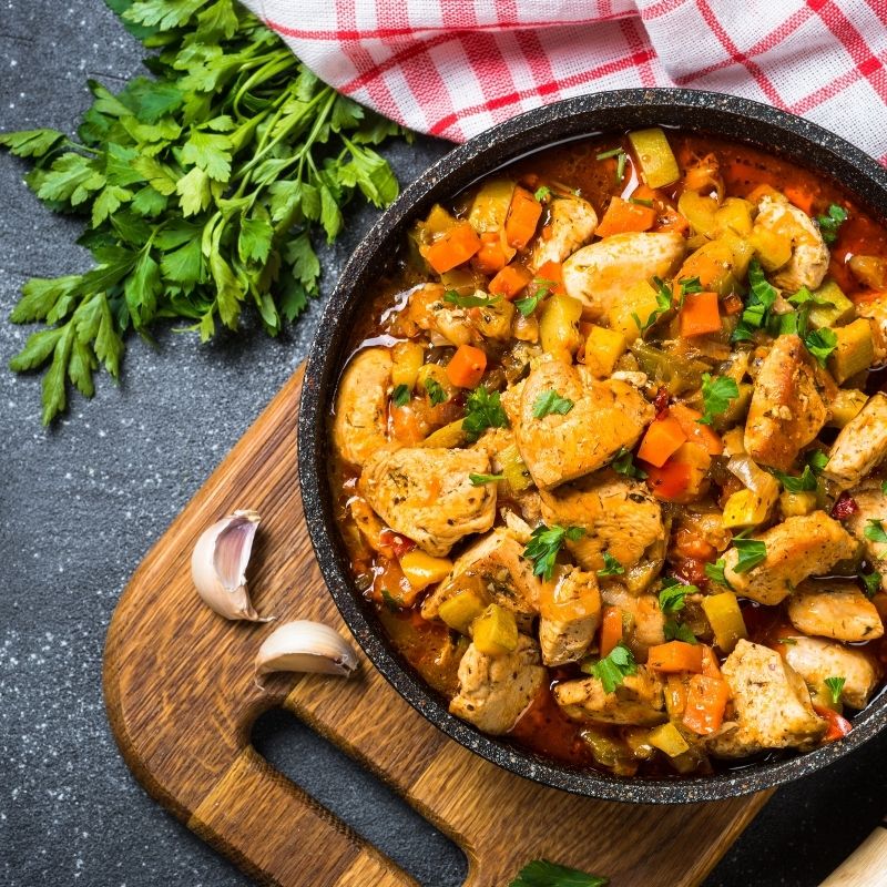 spanish stew in a pot on a wooden table. 25 Easy Spanish Dishes for Winter
