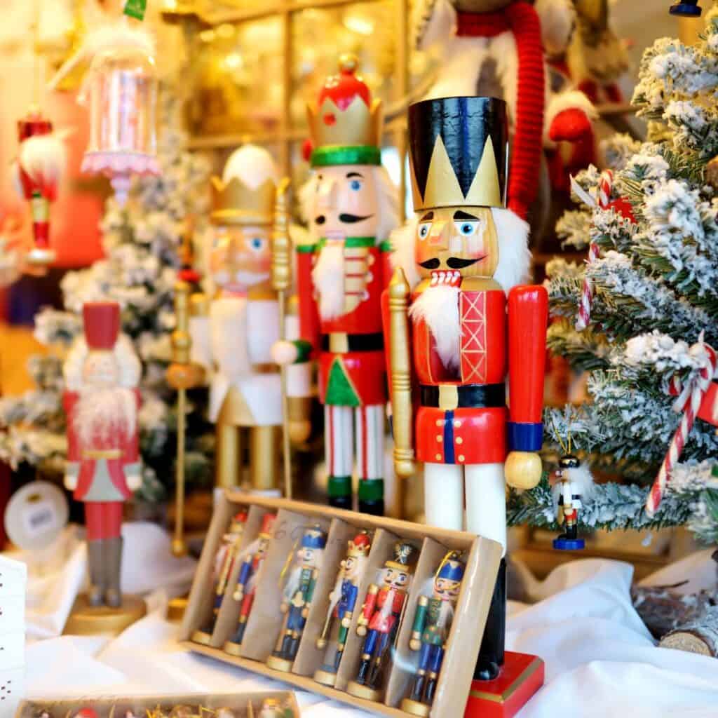 a display of nutcrackers and other christmas decorations on a christmas market