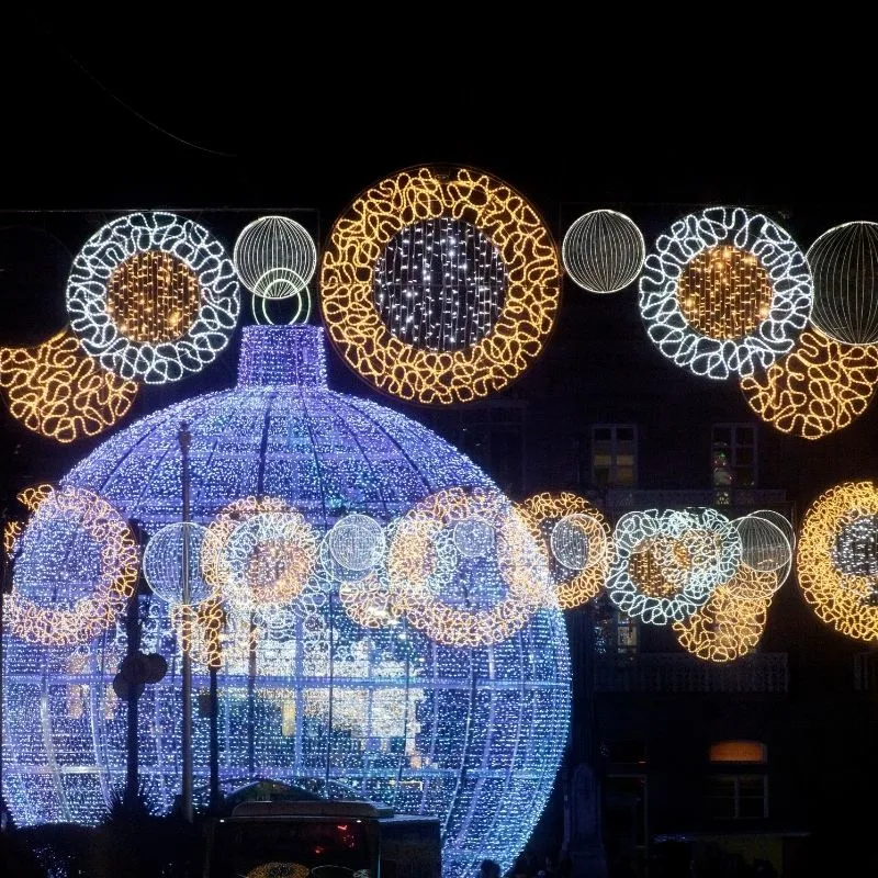 Puente Genil; a big blue  christmas ball with other smaller circular christmas lights around at night