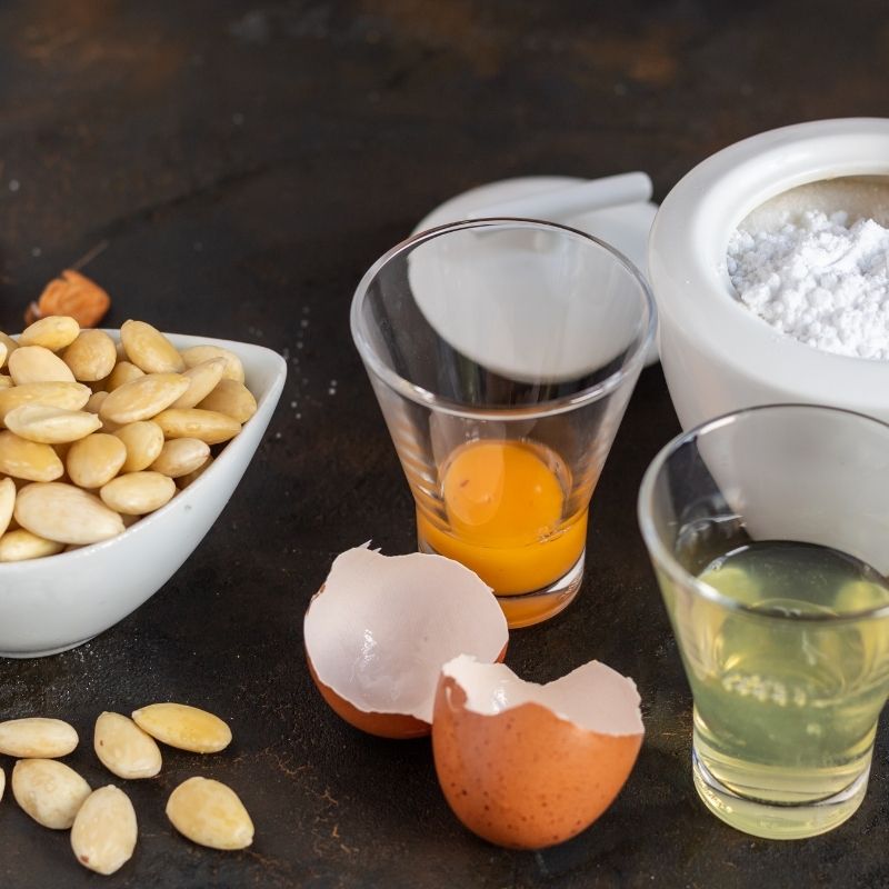 ingredients for spanish almond cookies like eggs, almonds and flour.