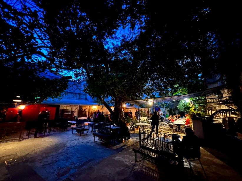 La Carboneria, a bar at night with trees and people