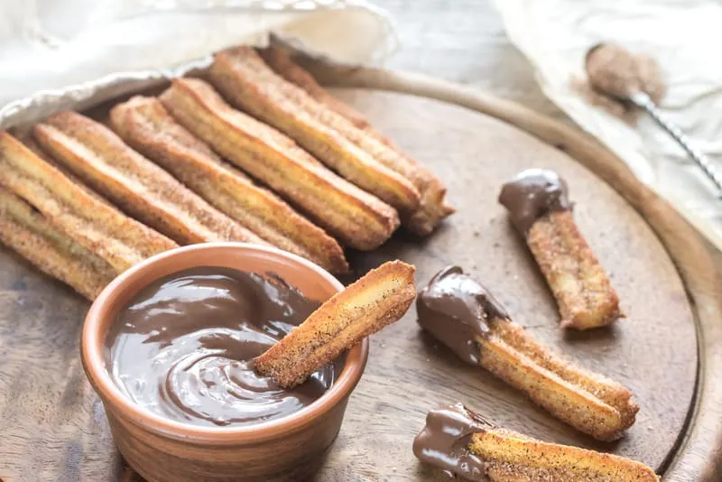 baked churros served with chocolate