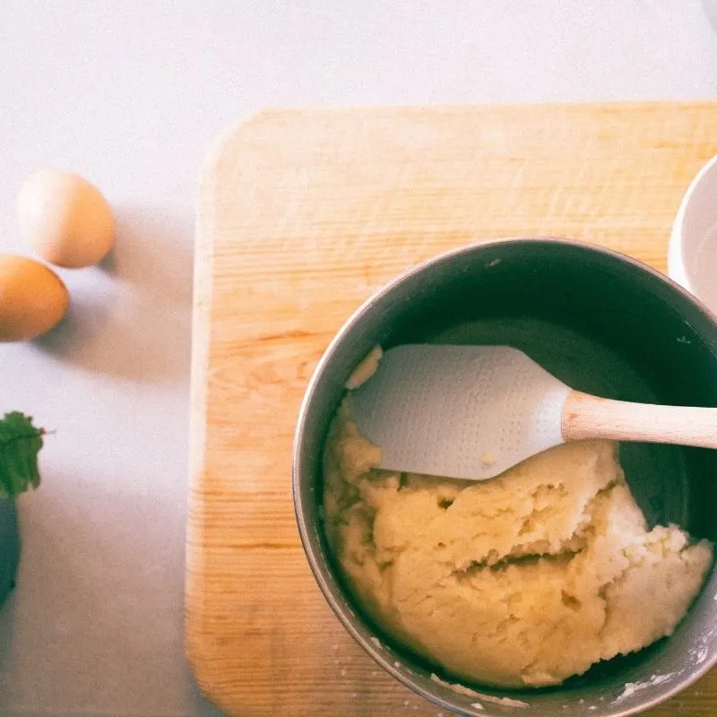 baked churros dough in a pot