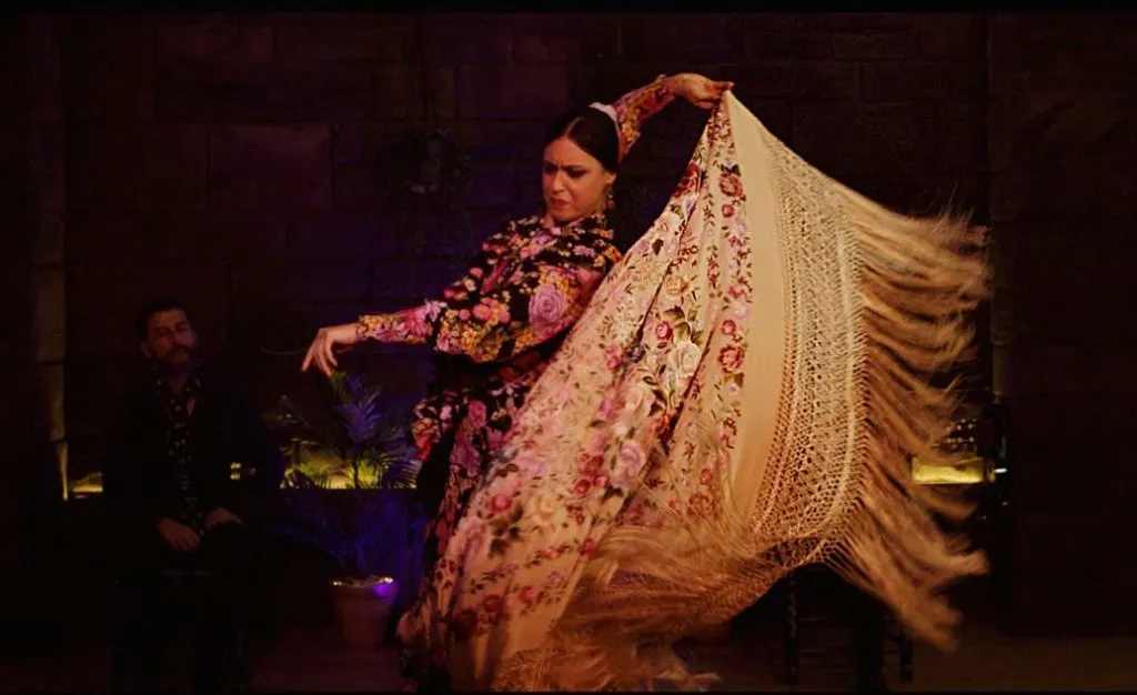 Baraka Sala Flamenca, a woman dancing with a large sarong