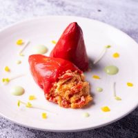 spanish stuffed peppers on a white plate.