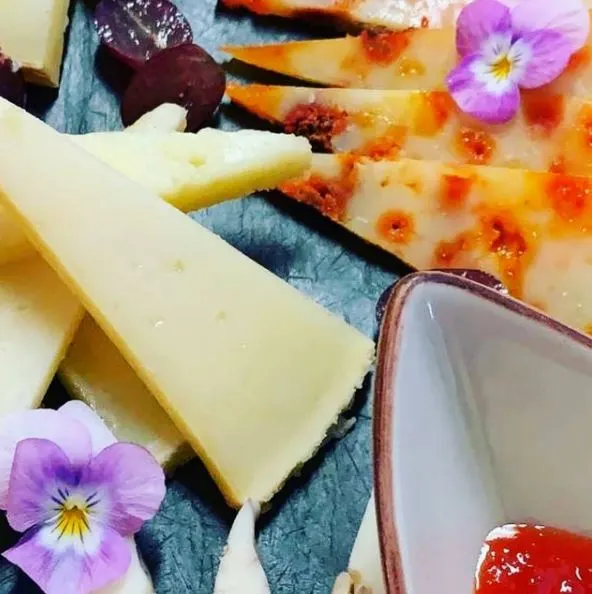 La Bartola, a closeup with cheese and flowers