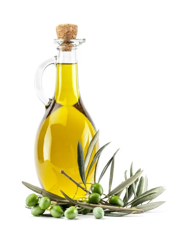 spanish olive oil in a glass bottle with olives next to it for the Spanish Salad Dressing