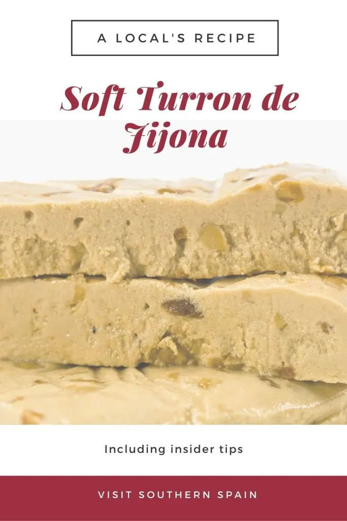 A closeup with 3 bars of soft turron stacked on top of each other. 