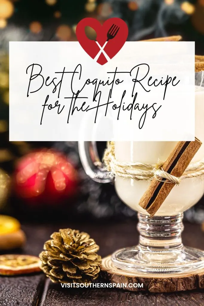A photo with a glass of coquito decorated with cinnamon next to Christmas tree decorations. On top of the photo it's written best coquito recipe for the holidays. 