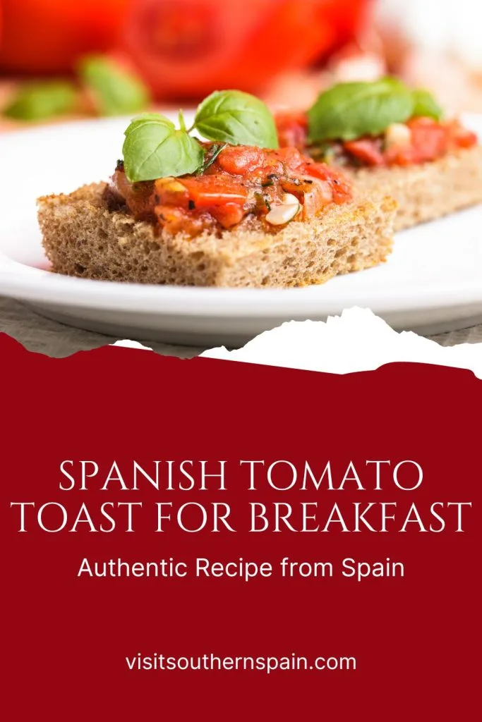 2 slices of Spanish tomato toast on a white late.