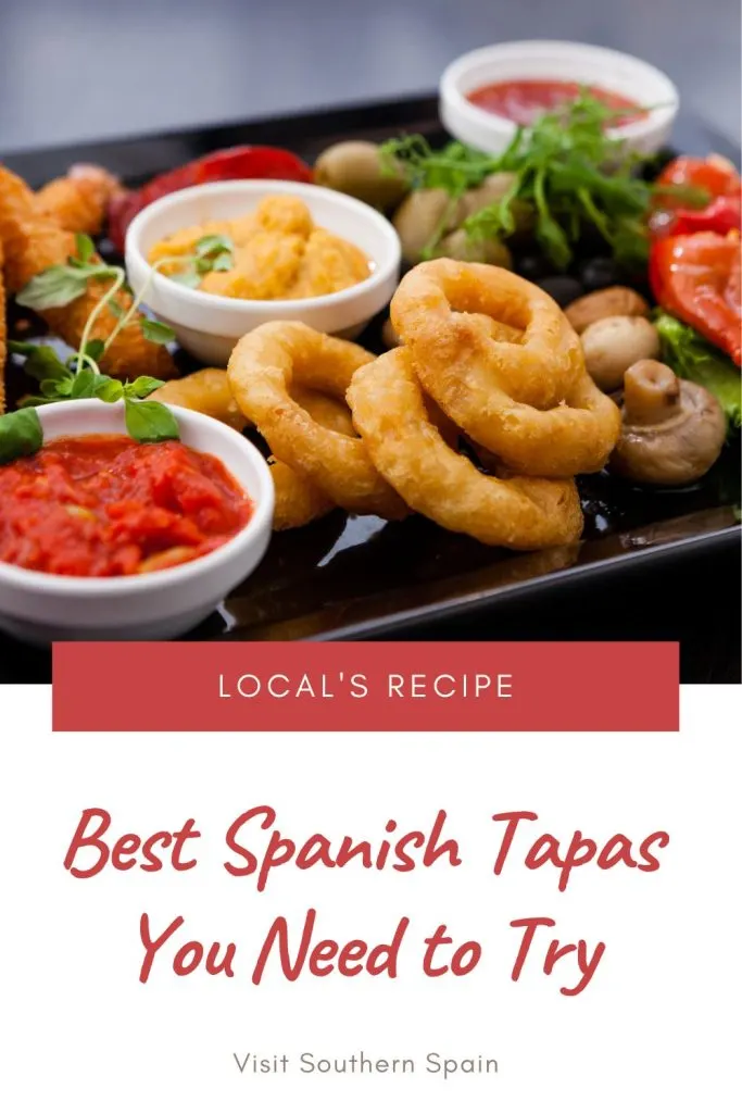 A dark plate with various spanish tapas and red sauce. Under the photo it's written Best spanish tapas you need to try.