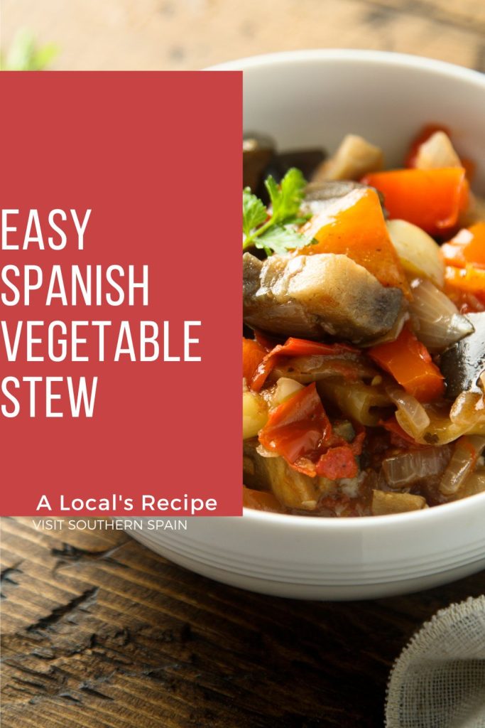 A bowl of Spanish vegetable stew on a wooden table. On the left side it's written Easy Spanish vegetable stew.