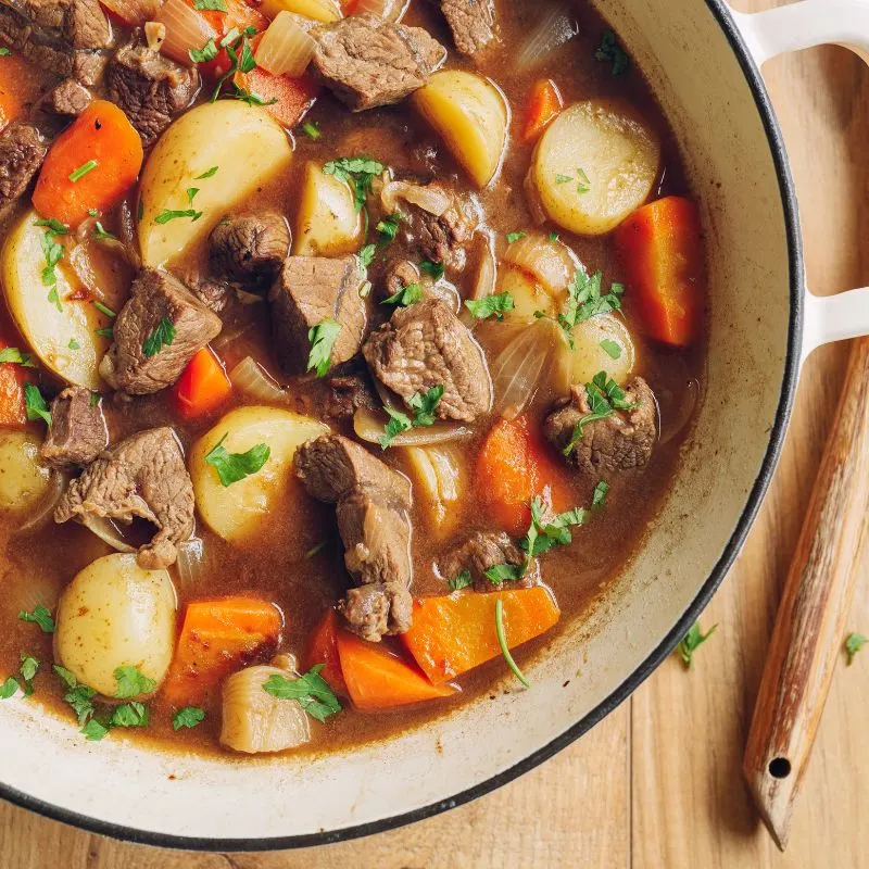 beef stew with potatoes, carrots and onion in a pot