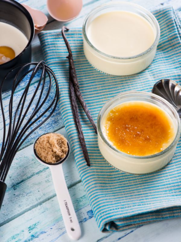 ingredients such as eggs, milk, sugar and utensils for creme catalan recipe