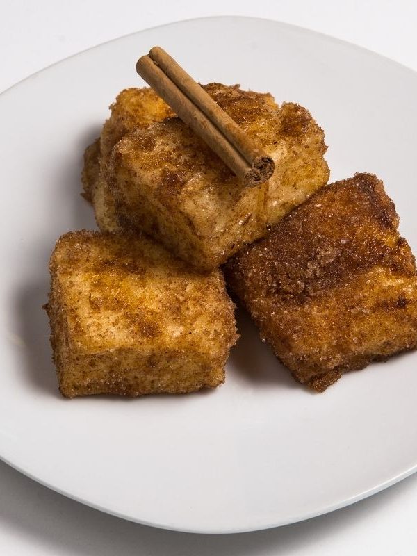 Spanish Fried Milk, leche frita on a plate white plate. 25 Ideas for the Best Spanish Themed Party 