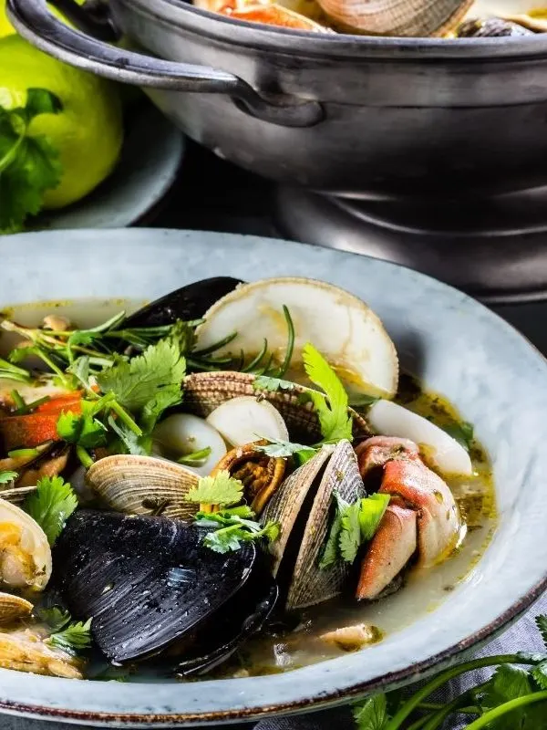 closeup with seafood stew in a bowl. 25 Best Spanish Seafood Recipes to Try at Once!