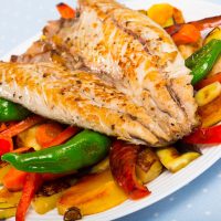 healthy mackerel recipe on baked vegetables.