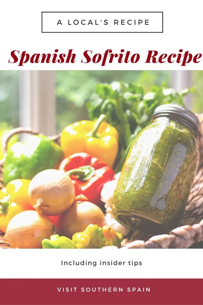 A jar of sofrito in a basket with vegetables. On top it's written Spanish Sofrito recipe.