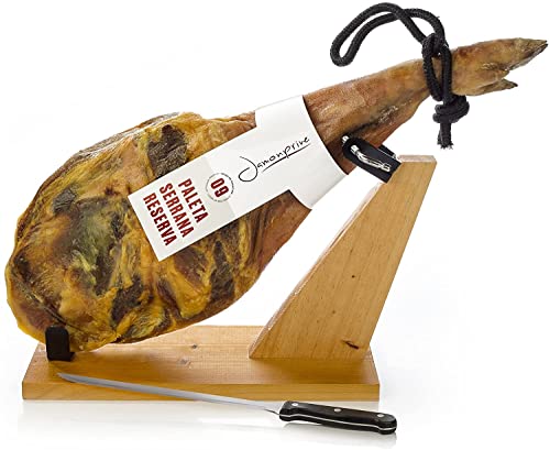 A Jamon Serrano on a wooden stand. 20 Best Spanish Souvenirs from Andalucia