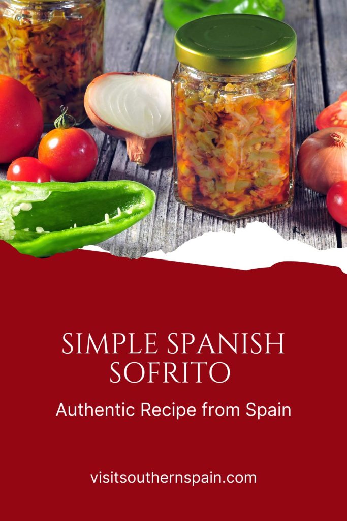 Sofrito in jars, next to peppers, tomatoes and onion. Under the photo it's written Simple Spanish sofrito.