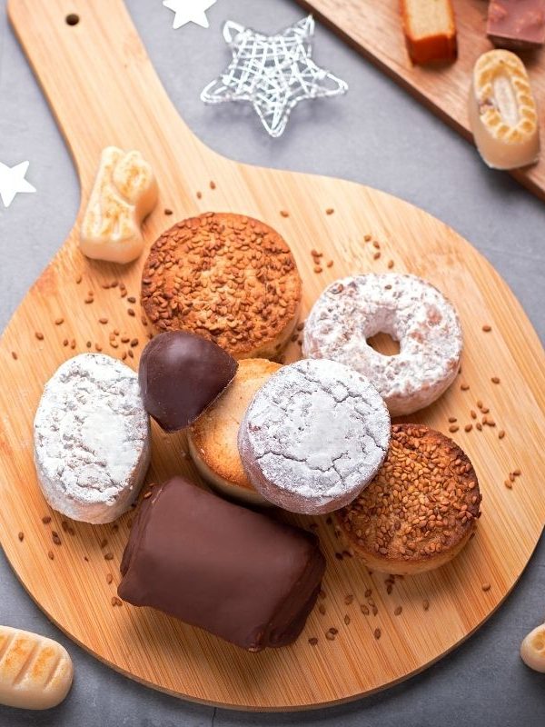 spanish pastries for breakfast on a wooden table with christmas decorations next to it. 20 Best Spanish Souvenirs from Andalucia