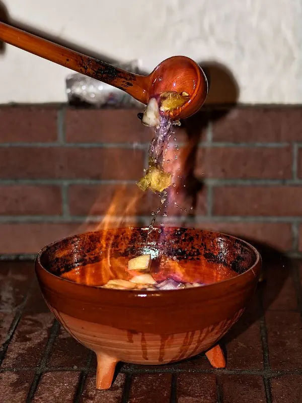 Queimada drink made in a clay pot and set on fire.